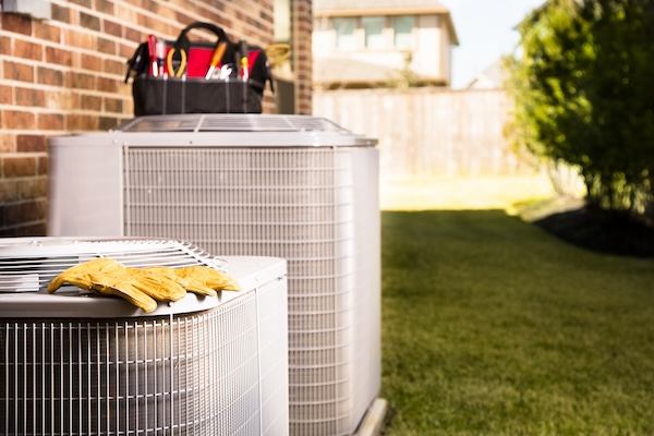 Service Industry Work Tools On Air Conditioners Outside Residential Home